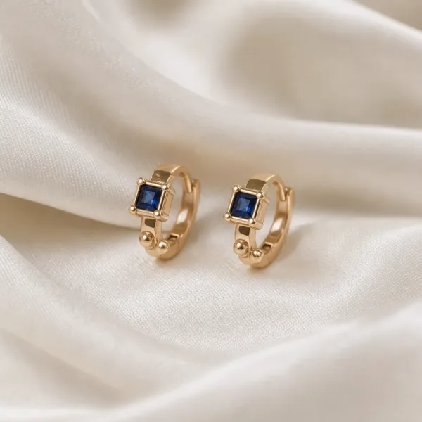 Brincos dourados rosa modelo C com cristal quadrado azul