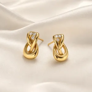 Brincos dourados com laço oval dourado