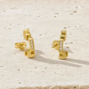 Brincos dourados geométricos com cristais
