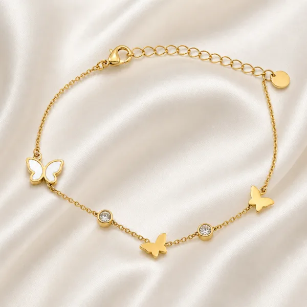 pulseira dourada com borboletas e cristais em cetim marfim, referência 85382-2