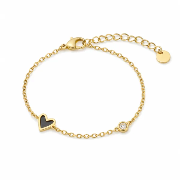 85382-3-white pulseira dourada com coração preto e cristal em fundo branco, referência 85382-3