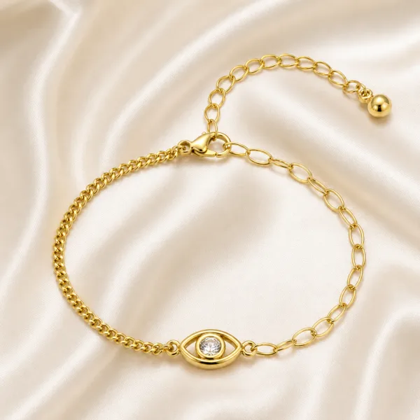 pulseira dourada olho protetor com cristal em cetim marfim, referência 85383-1