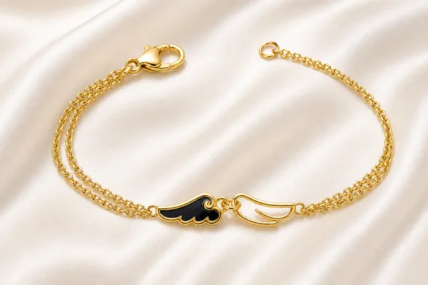 pulseira dourada com asas pretas em cetim marfim, referência 85383-2