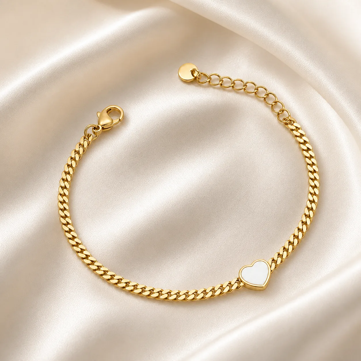 pulseira dourada com coração branco e corrente cubana em cetim marfim, referência 85384-4
