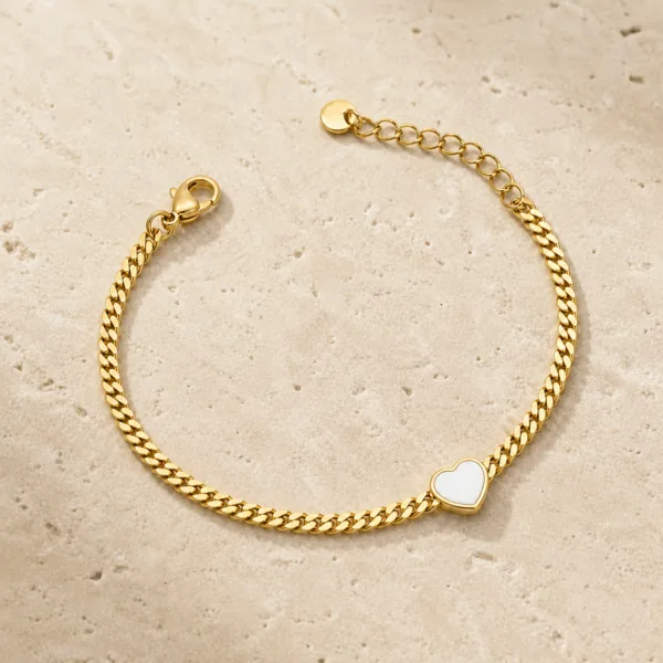 pulseira dourada com coração branco e corrente cubana em pedra clara de tom quente, referência 85384-4
