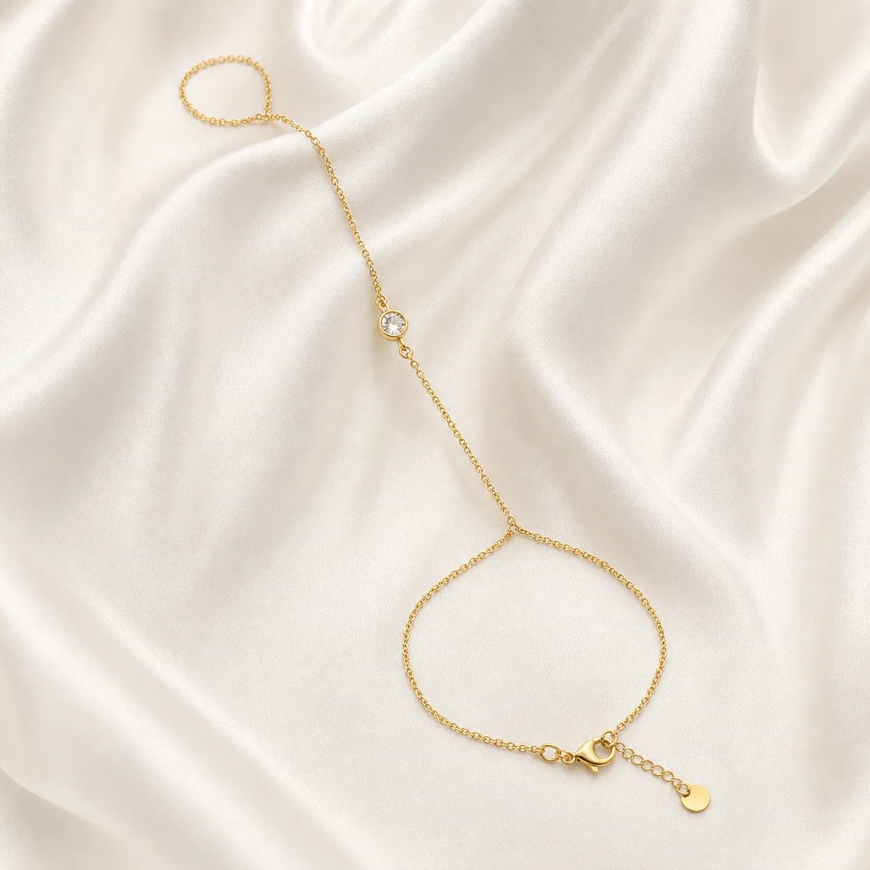 pulseira de mão dourada minimalista com cristal em cetim marfim, referência 85473-1