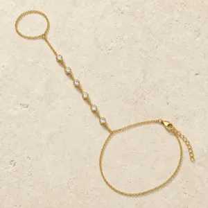 pulseira de mão dourada com seis cristais em pedra clara de tom quente, referência 85474-3