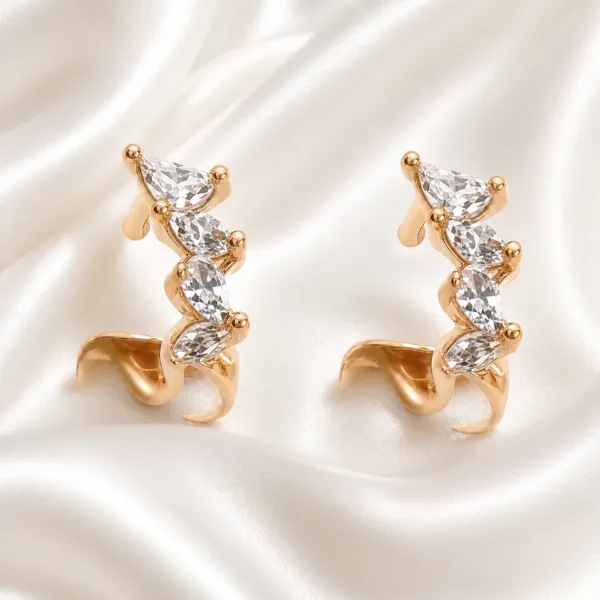 Brincos ear cuff dourados rosa com cristais brancos sobre cetim - Modelo A