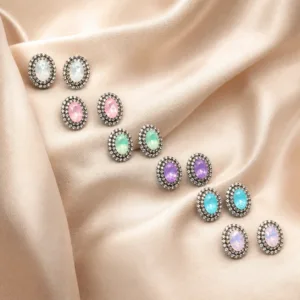 Brincos de cristal oval pastel 85176-01-2 — seis cores sobre cetim bege